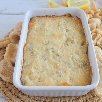 This warm artichoke dip is a creamy baked snack - perfect for game day! #thm #low-carb #trimhealthymama #healthy